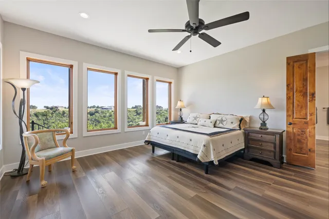 a kitchen with lots of clutter and cabinets