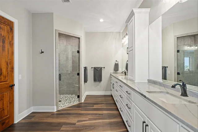a living room with a bed furniture and a flat screen tv