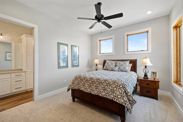 a spacious bathroom with a double vanity sink a shower and a mirror