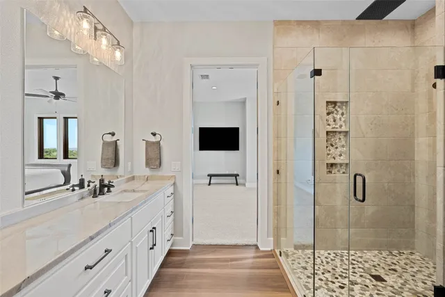 a bathroom with a double vanity sink and mirror