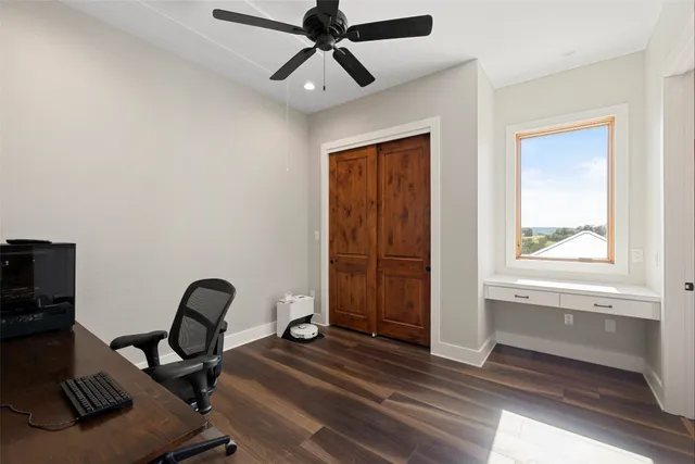 a bathroom with a tub shower vanity and a sink