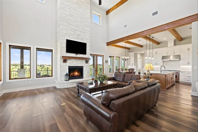 a living room with furniture fireplace and flat screen tv