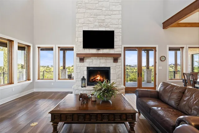a living room with furniture fireplace and window
