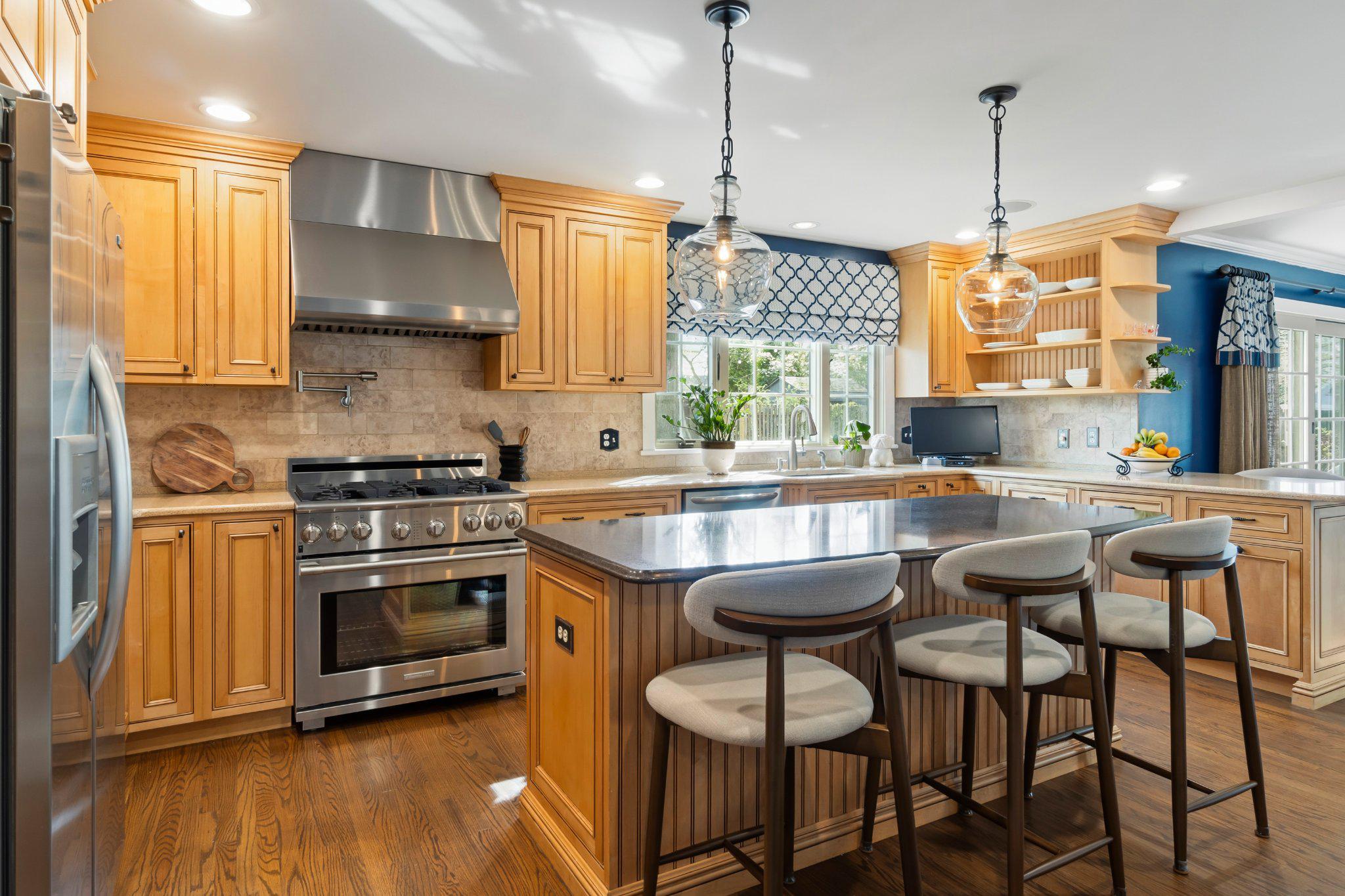 272 Jefferson Avenue Haddonfield, NJ 08033 - Photo 13 of 43 a kitchen with granite countertop a stove a sink and chairs