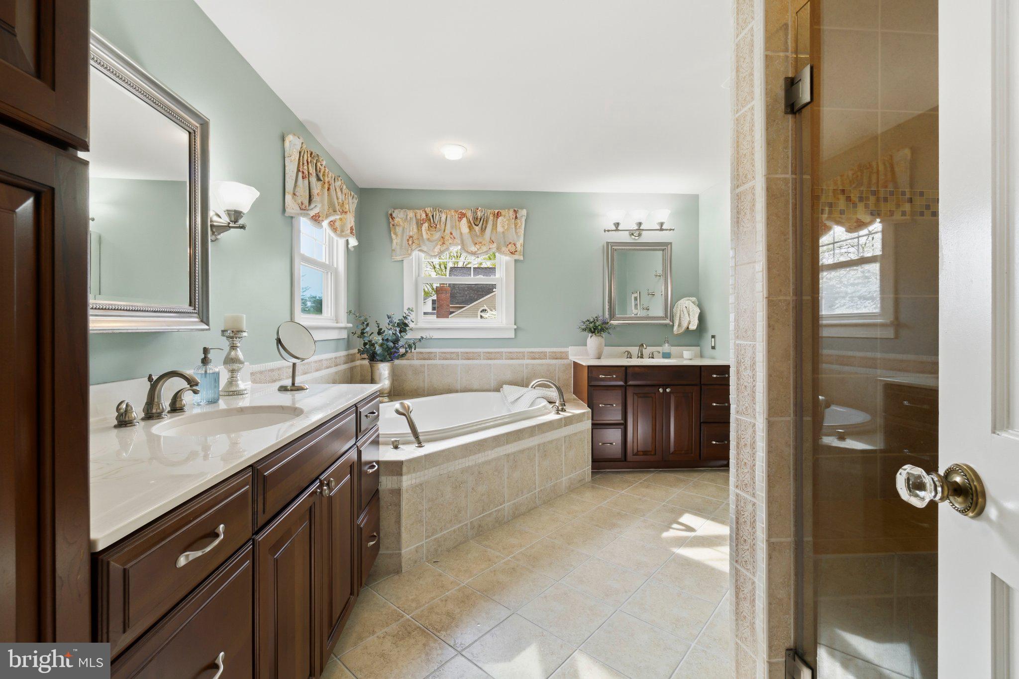 272 Jefferson Avenue Haddonfield, NJ 08033 - Photo 23 of 43 a spacious bathroom with a bathtub double sink and mirror