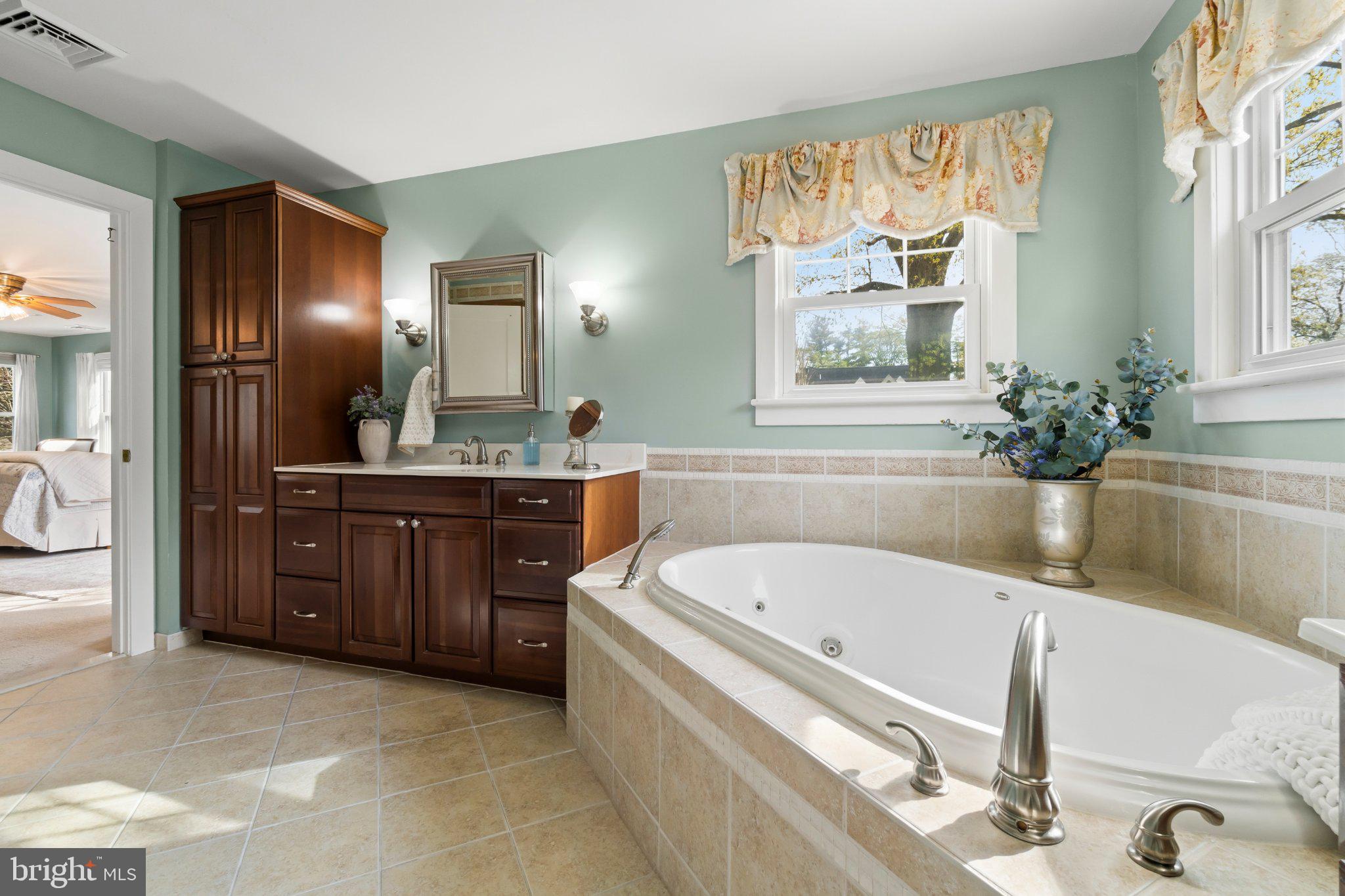 272 Jefferson Avenue Haddonfield, NJ 08033 - Photo 24 of 43 a spacious bathroom with a tub sink and mirror