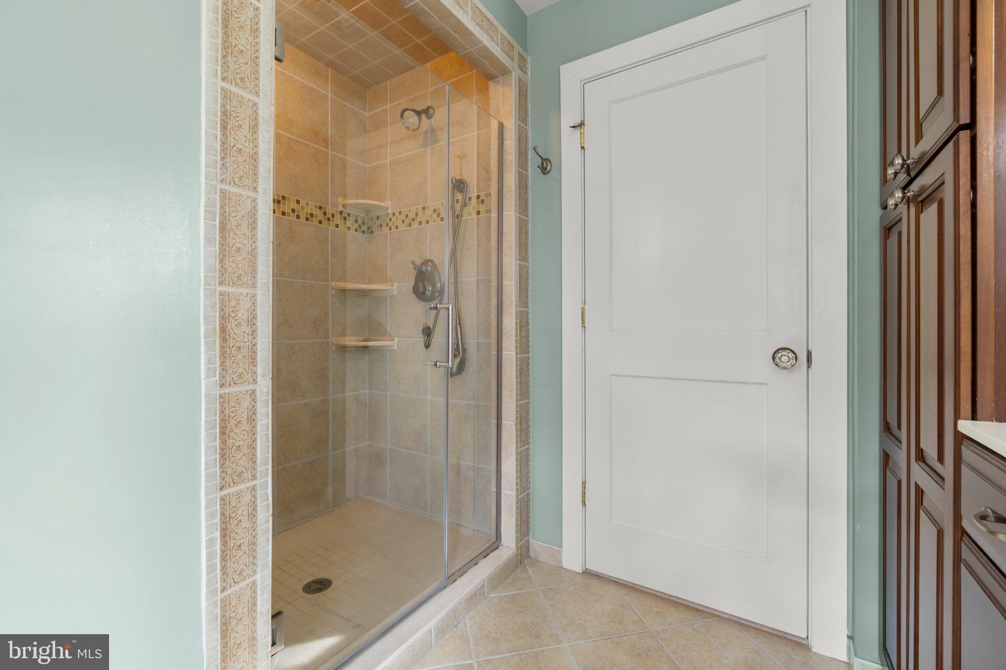 272 Jefferson Avenue Haddonfield, NJ 08033 - Photo 25 of 43 a bathroom with a glass shower door