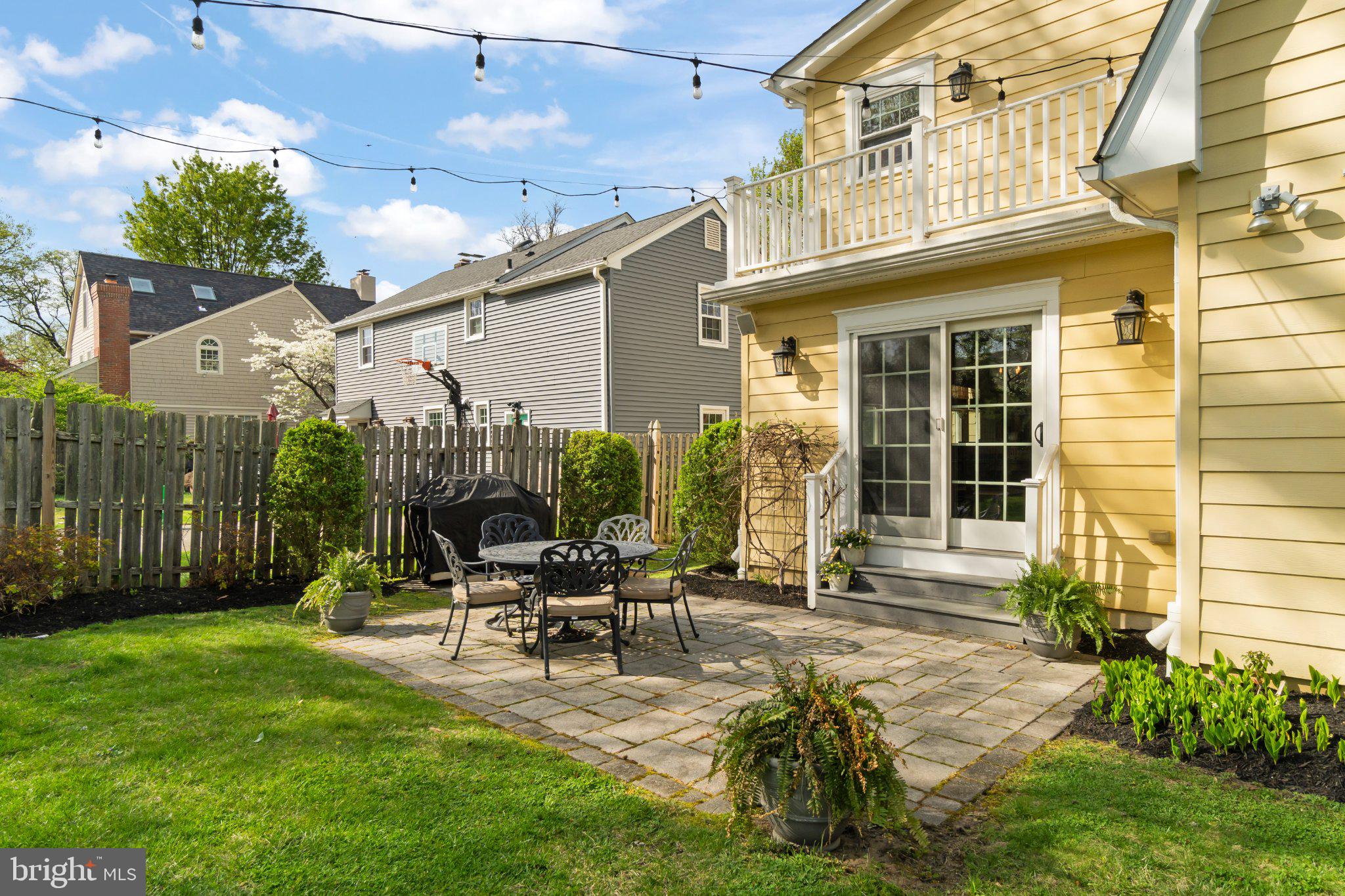 272 Jefferson Avenue Haddonfield, NJ 08033 - Photo 36 of 43 a view of a patio with table and chairs with wooden fence and plants
