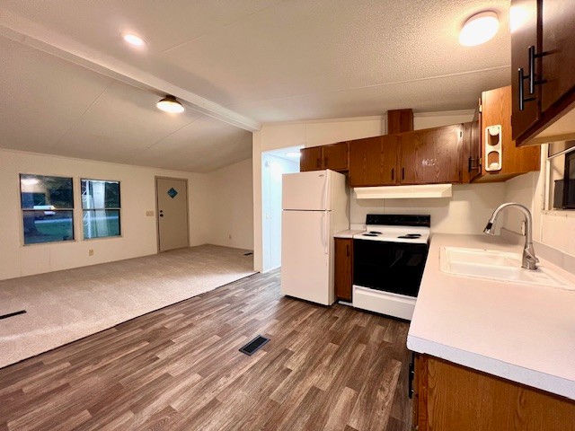 413 Elm Lane Beechgrove, TN 37018 - Photo 6 of 16 a kitchen with a refrigerator and a stove top oven