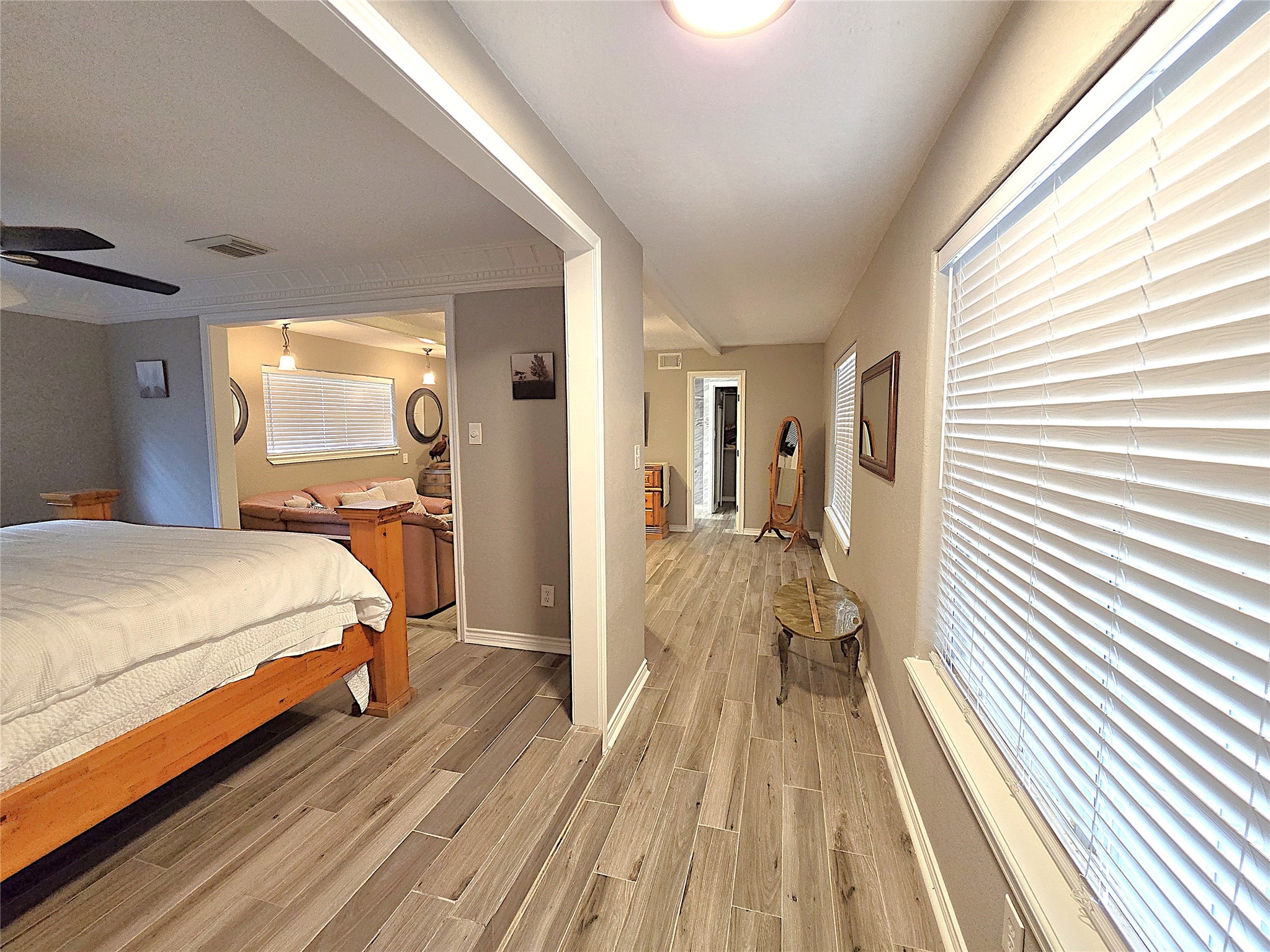 560 Brandon Road Conroe, TX 77302 - Photo 27 of 45 Spacious master suite with elegant flooring, abundant natural light, and a cozy sitting area—perfect for relaxation.