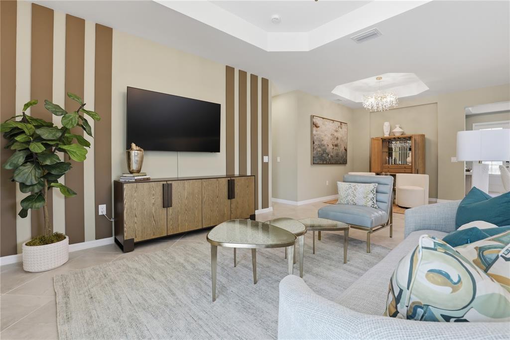 7153 Inlet Isles Lakewood Ranch, FL 34202 - Photo 6 of 26 a living room with furniture and a flat screen tv