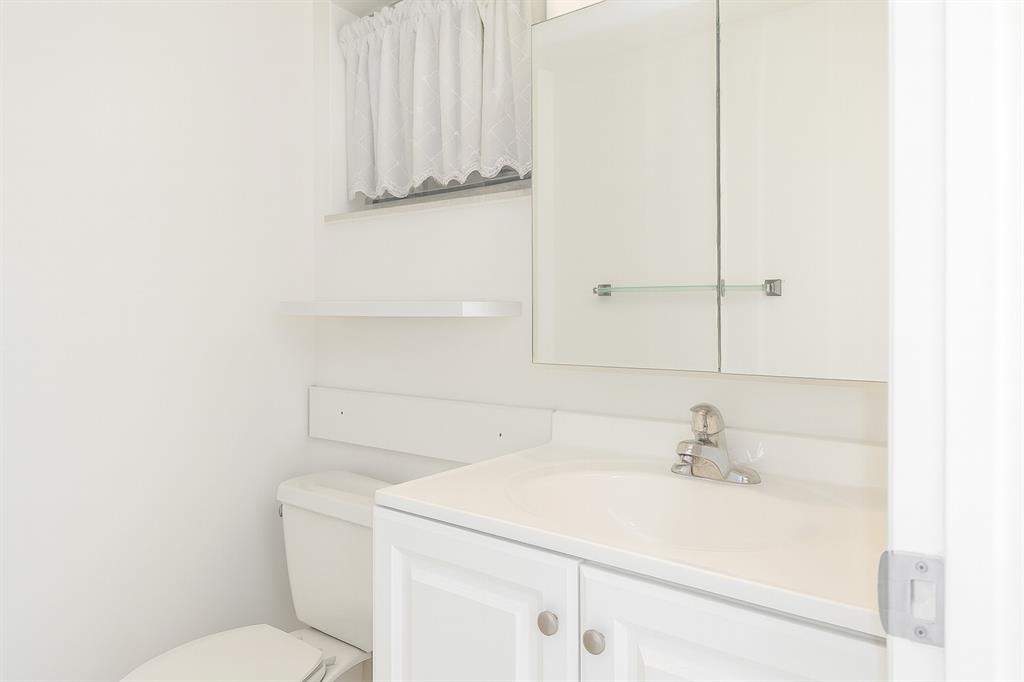 950 Hillcrest Drive, Unit 202 Hollywood, FL 33021 - Photo 5 of 19 a bathroom with a sink and a toilet