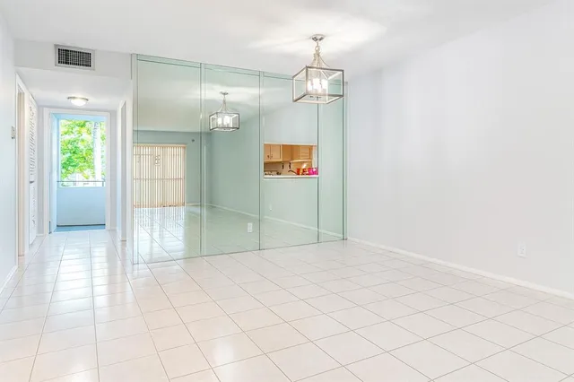 a view of an empty room and window