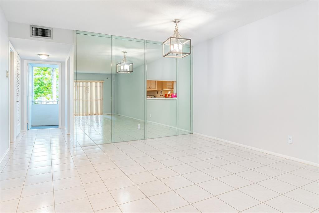 950 Hillcrest Drive, Unit 202 Hollywood, FL 33021 - Photo 6 of 19 a view of an empty room and window