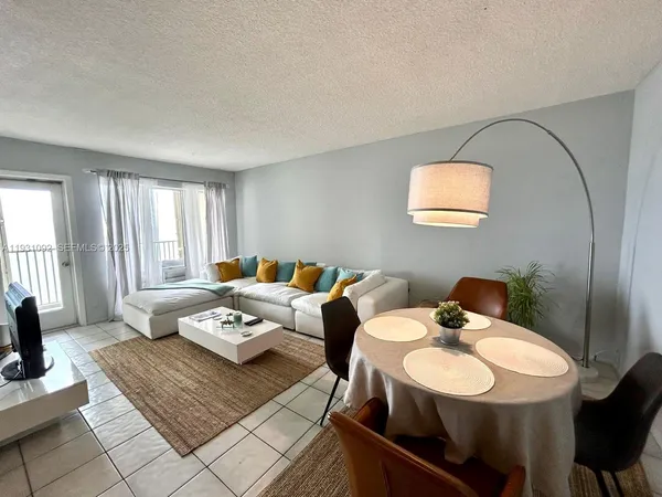 a living room with furniture and a window