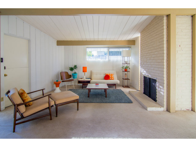 795 Greer Road Palo Alto, CA 94303 - Photo 5 of 9 a living room with furniture and a fireplace