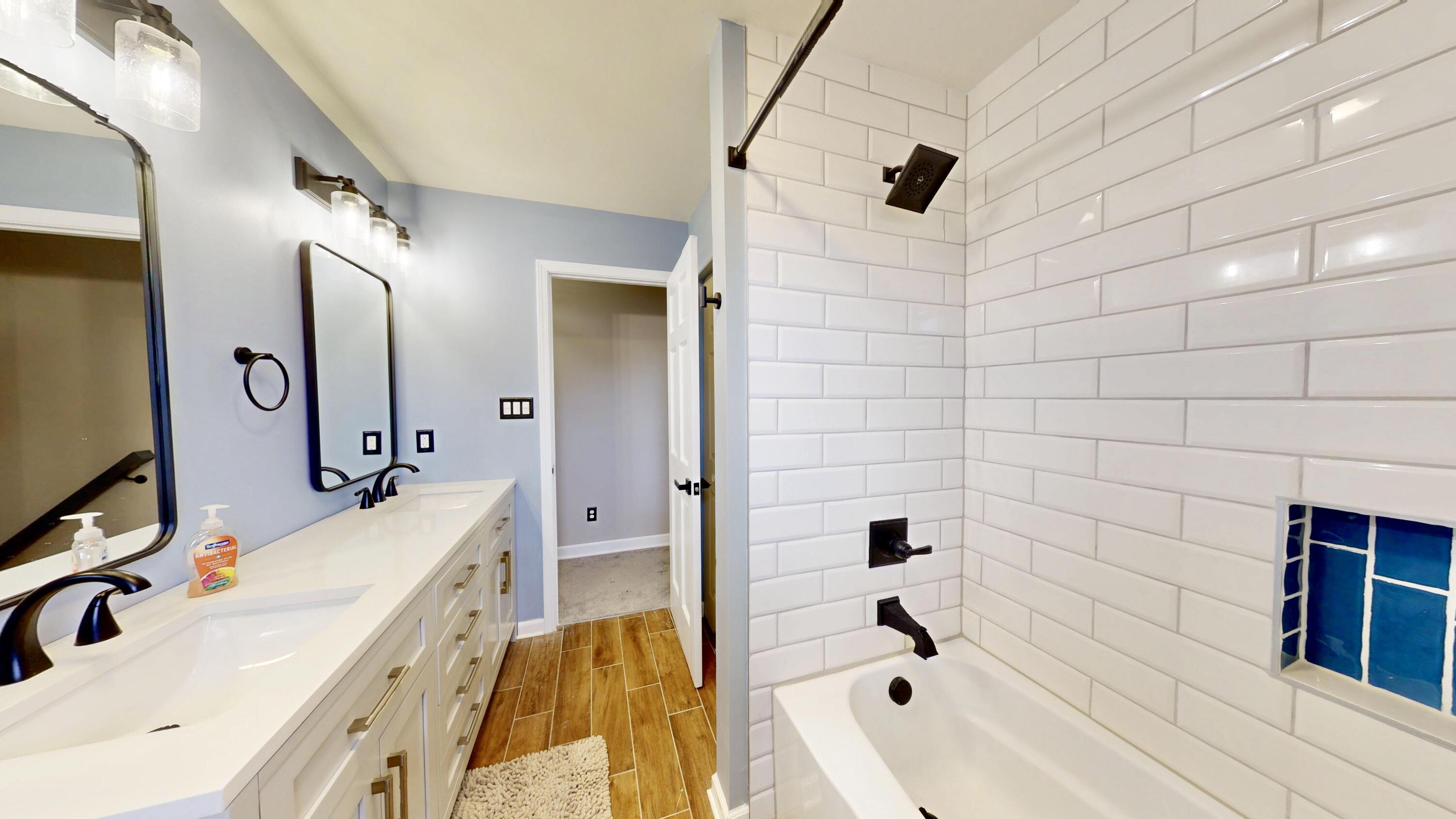 3721 Wirth Road Highland, IN 46322 - Photo 14 of 40 a bathroom with a tub sink and mirror