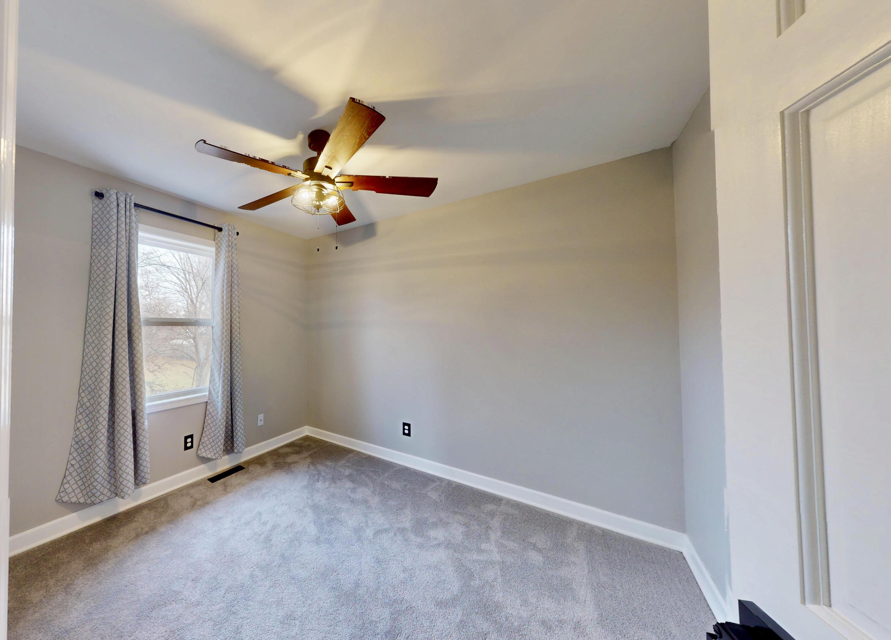 3721 Wirth Road Highland, IN 46322 - Photo 21 of 40 an empty room with windows and fan