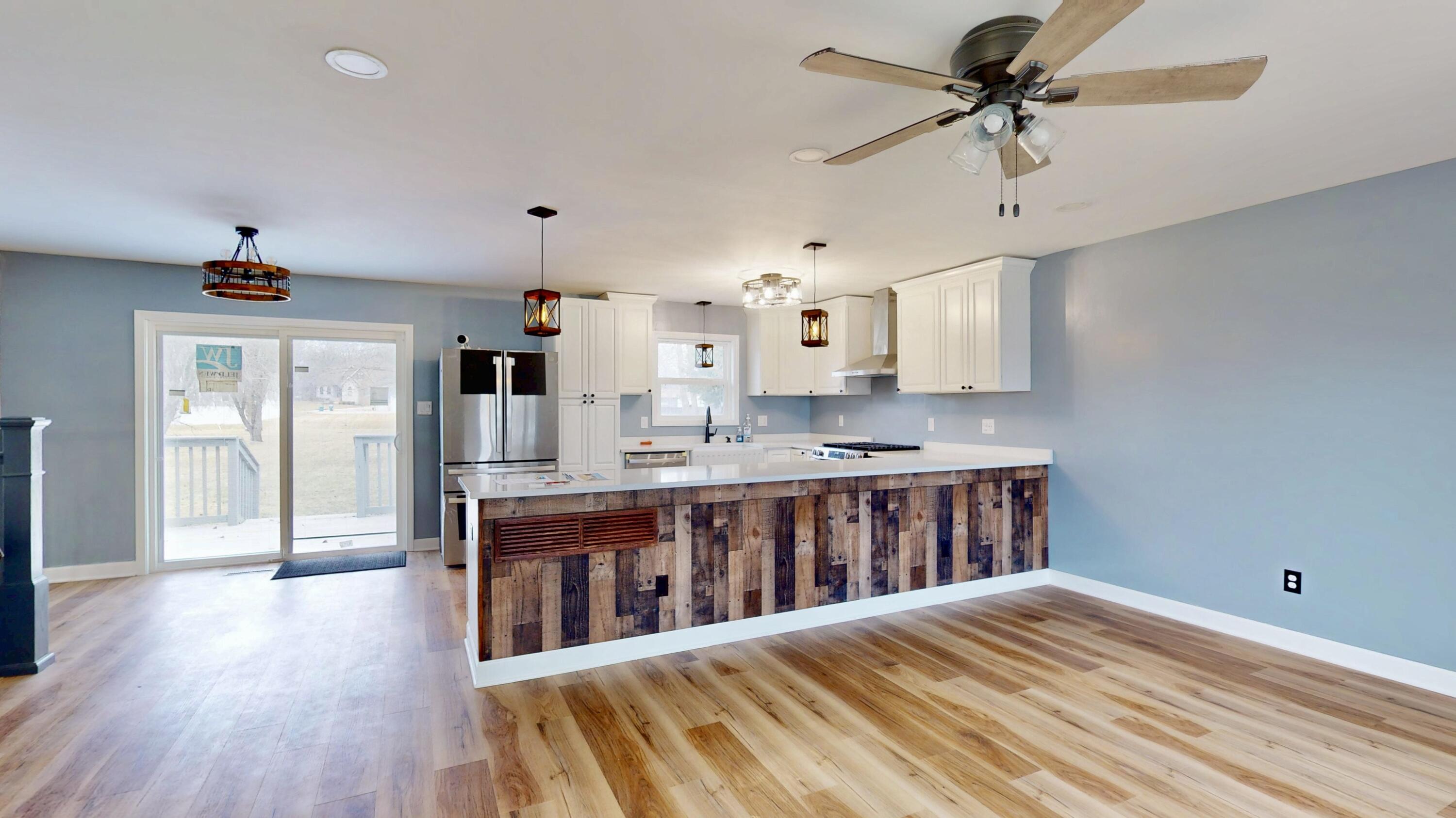 3721 Wirth Road Highland, IN 46322 - Photo 4 of 40 a open kitchen with stainless steel appliances kitchen island a refrigerator and a view of living room