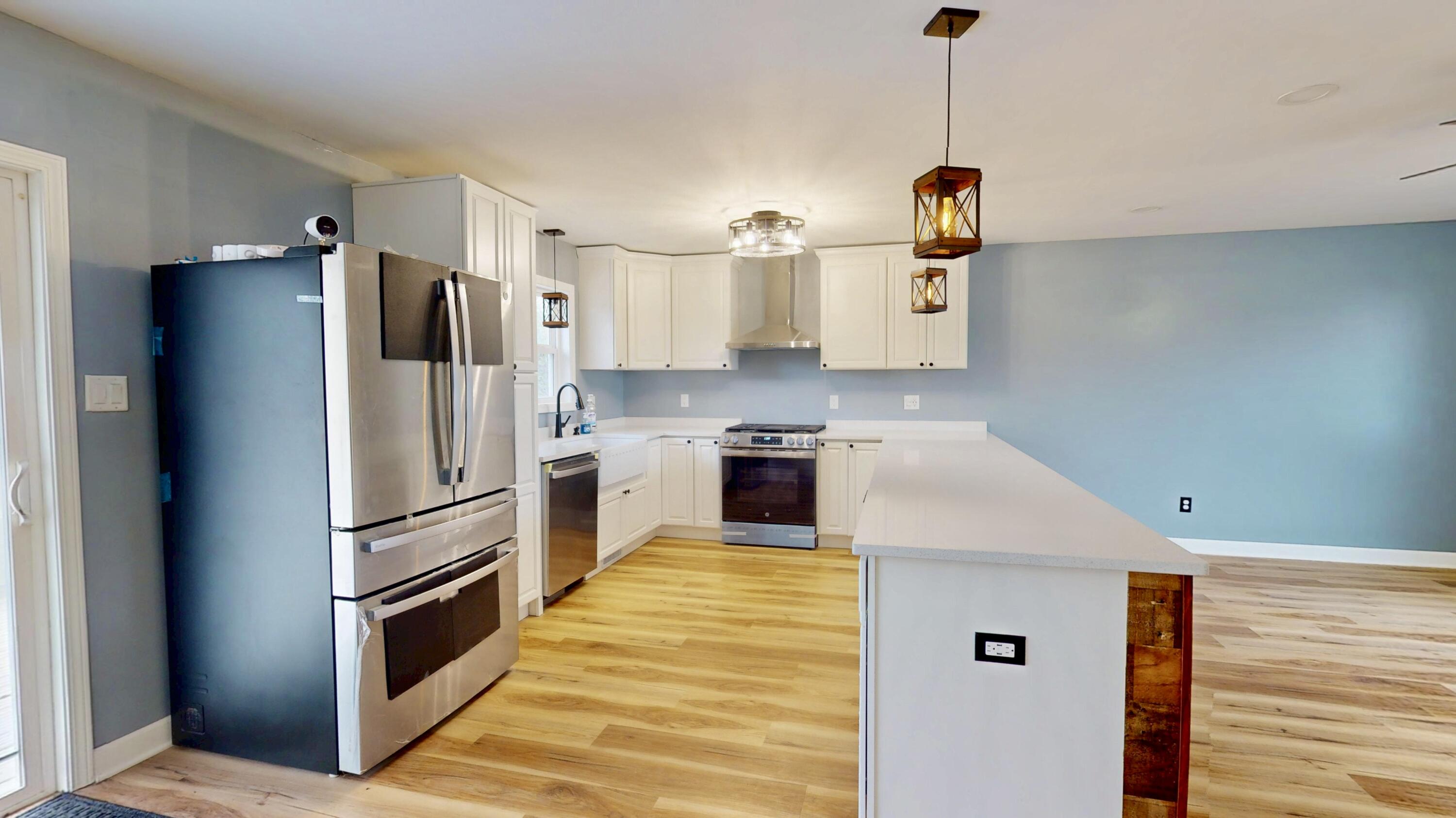 3721 Wirth Road Highland, IN 46322 - Photo 9 of 40 a kitchen with stainless steel appliances granite countertop a refrigerator a stove and a sink