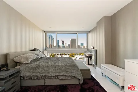 a bedroom with a large bed and a table