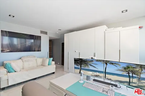a living room with a flat screen tv and a couch