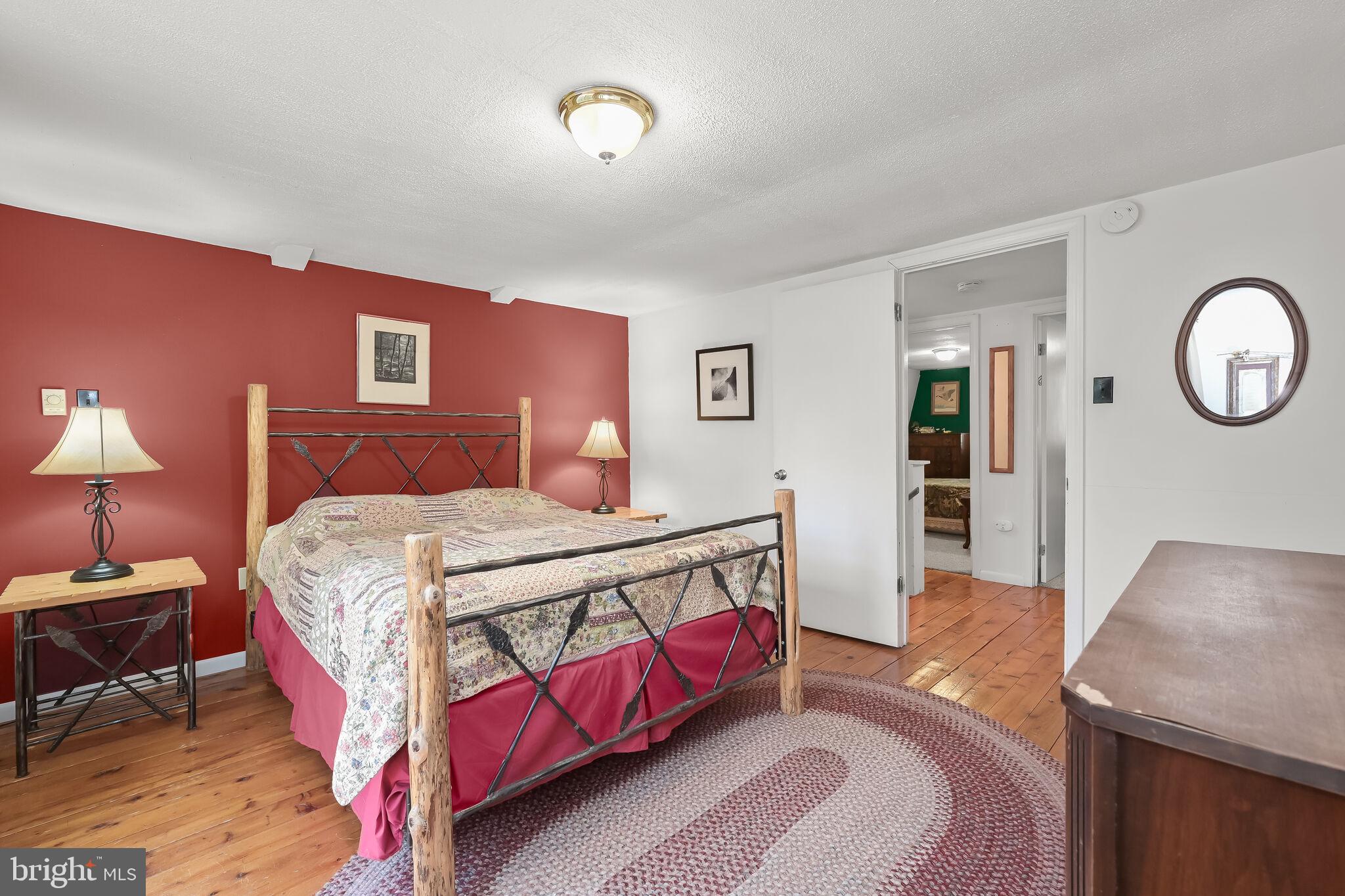 2702 Mayhew Inn Road Oakland, MD 21550 - Photo 35 of 87 Primary Bedroom | Balcony | Hardwood Floors