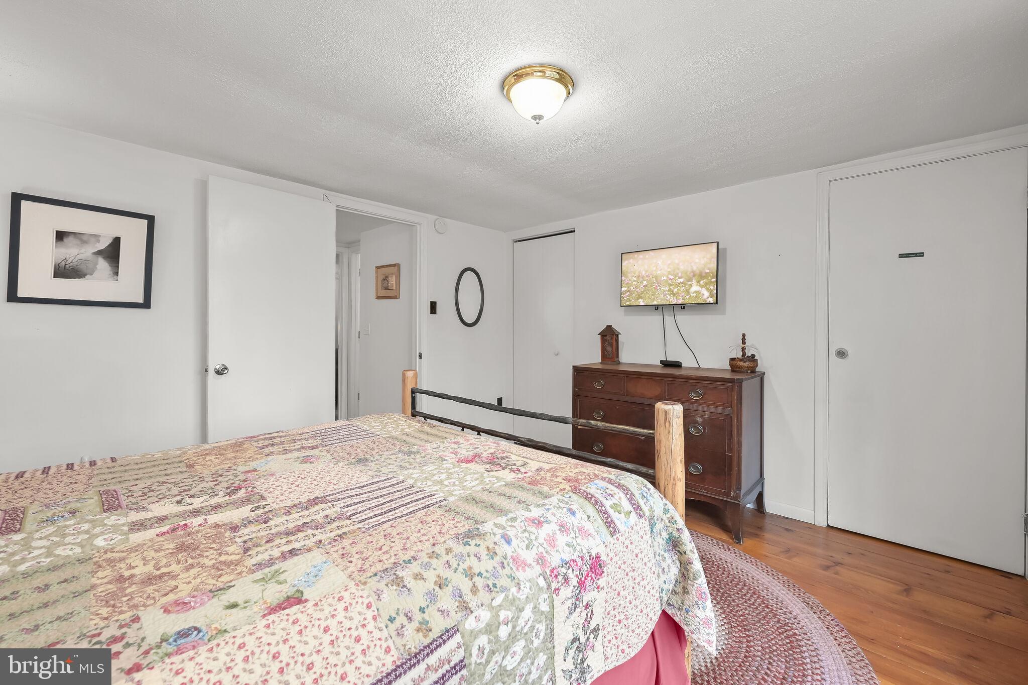 2702 Mayhew Inn Road Oakland, MD 21550 - Photo 36 of 87 Primary Bedroom | Balcony | Hardwood Floors