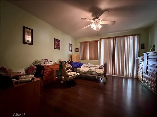 a living room with furniture window and wooden floor
