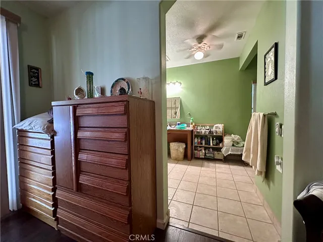 a bed room with a bed and a mirror