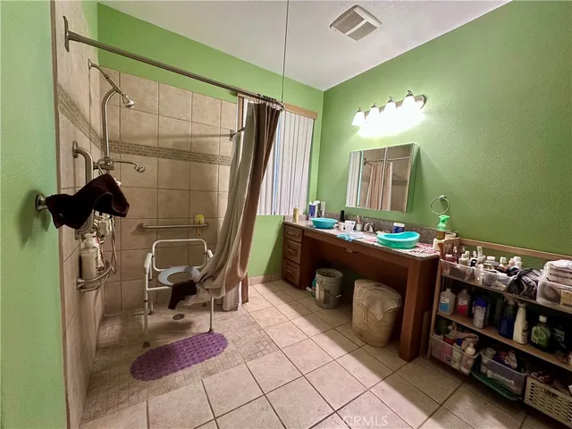 a living room with furniture and a mirror