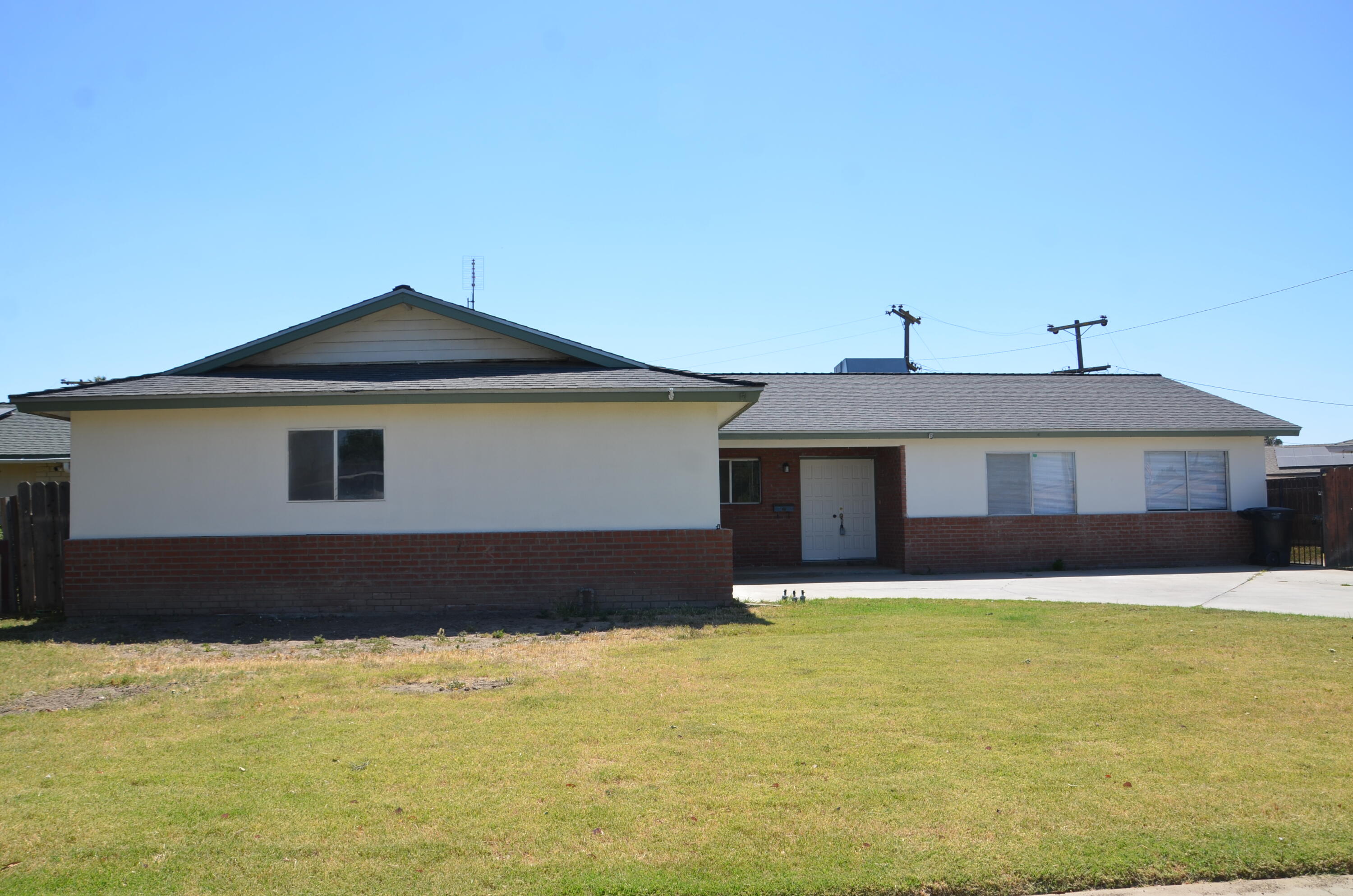 339 West Spring Lane Lemoore, CA 93245 - Photo 31 of 31 a front view of a house with a yard