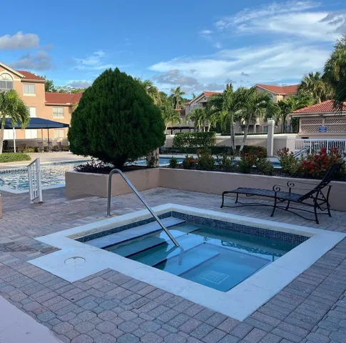 a view of a swimming pool with a patio