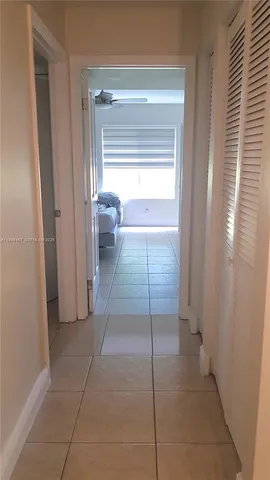 a view of a room that has a bed in it