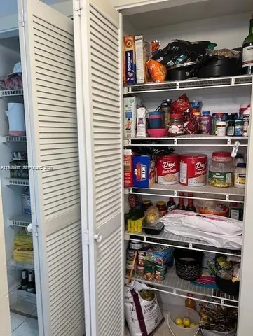 a kitchen with a stove and cabinets