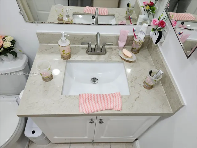 a bathroom with a sink and mirror