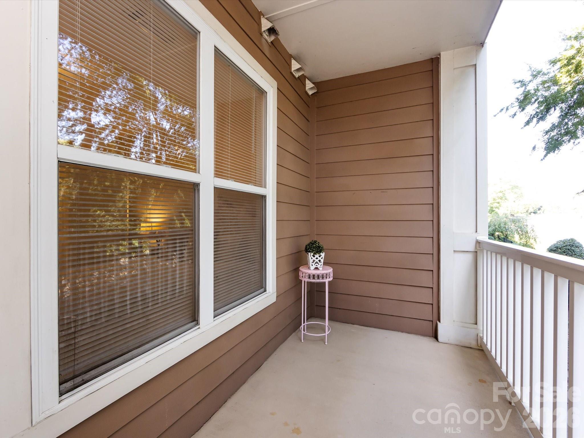 1000 East Woodlawn Road, Unit 113 Charlotte, NC 28209 - Photo 15 of 32 a view of outdoor space with porch