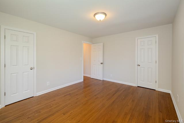 29 Avon Road Hewlett, NY 11557 - Photo 10 of 17 Unfurnished bedroom featuring wood finished floors