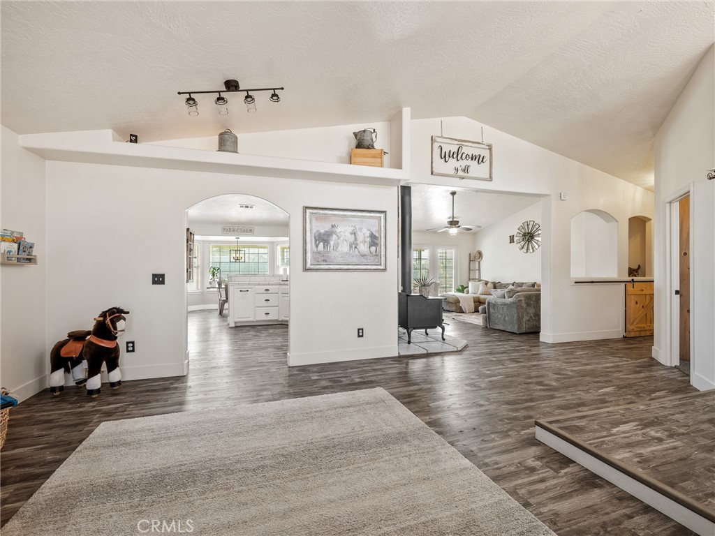 6370 Fremontia Road Hesperia, CA 92344 - Photo 14 of 62 a living room with furniture and a refrigerator
