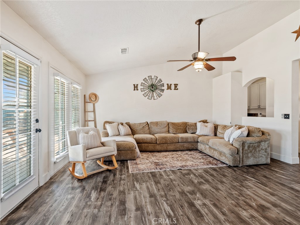 6370 Fremontia Road Hesperia, CA 92344 - Photo 19 of 62 a living room with furniture and a chandelier