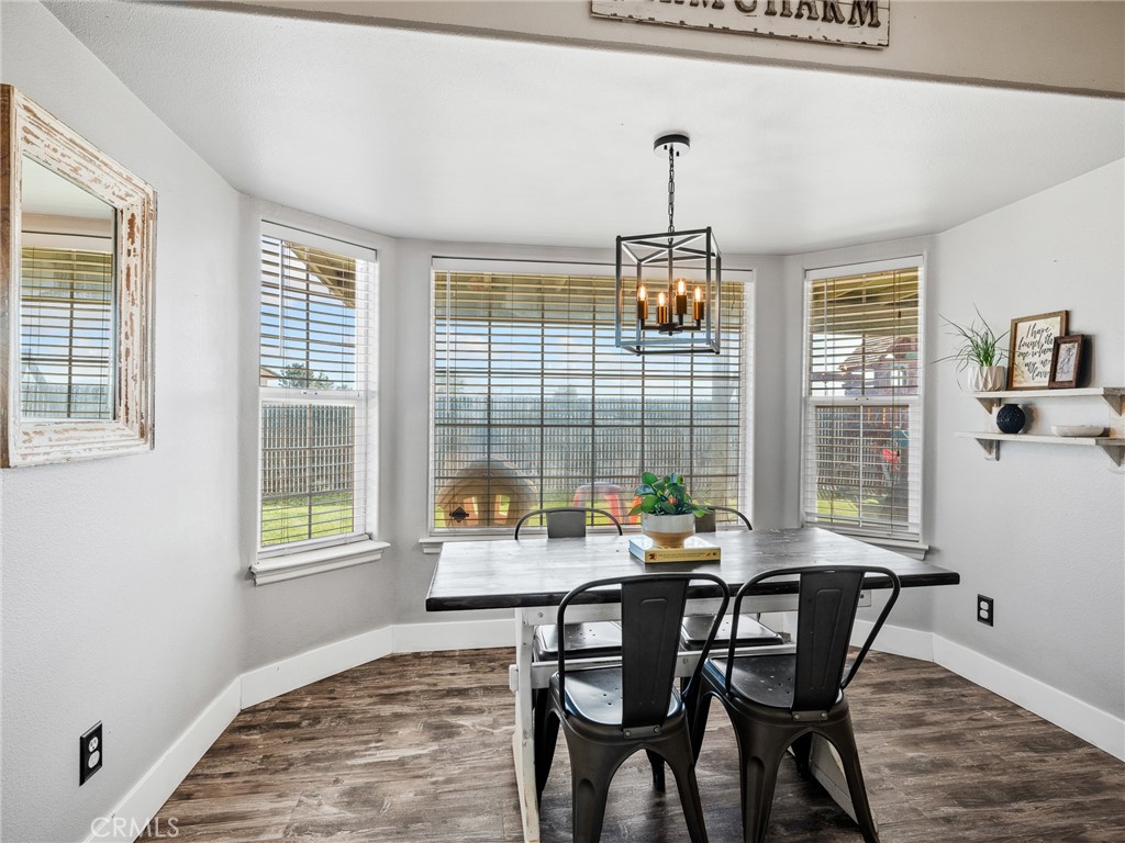 6370 Fremontia Road Hesperia, CA 92344 - Photo 24 of 62 a dining room with furniture and window