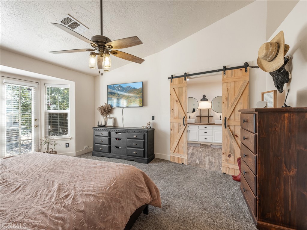 6370 Fremontia Road Hesperia, CA 92344 - Photo 31 of 62 a bedroom with a bed and wooden floor