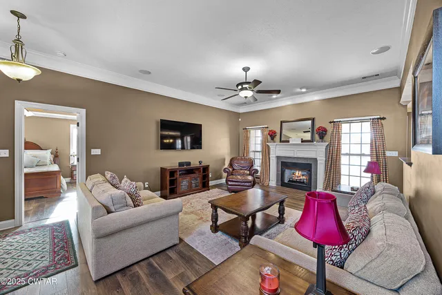 a living room with furniture and a fireplace