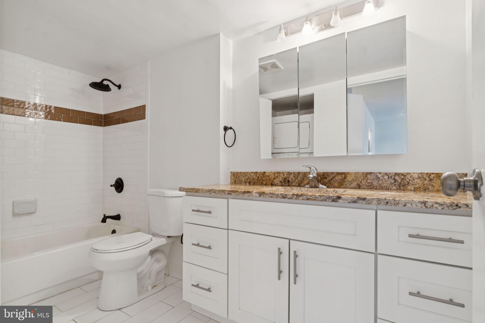 1420 Locust Street, Unit 7L Philadelphia, PA 19102 - Photo 11 of 25 a bathroom with a sink toilet vanity and tub
