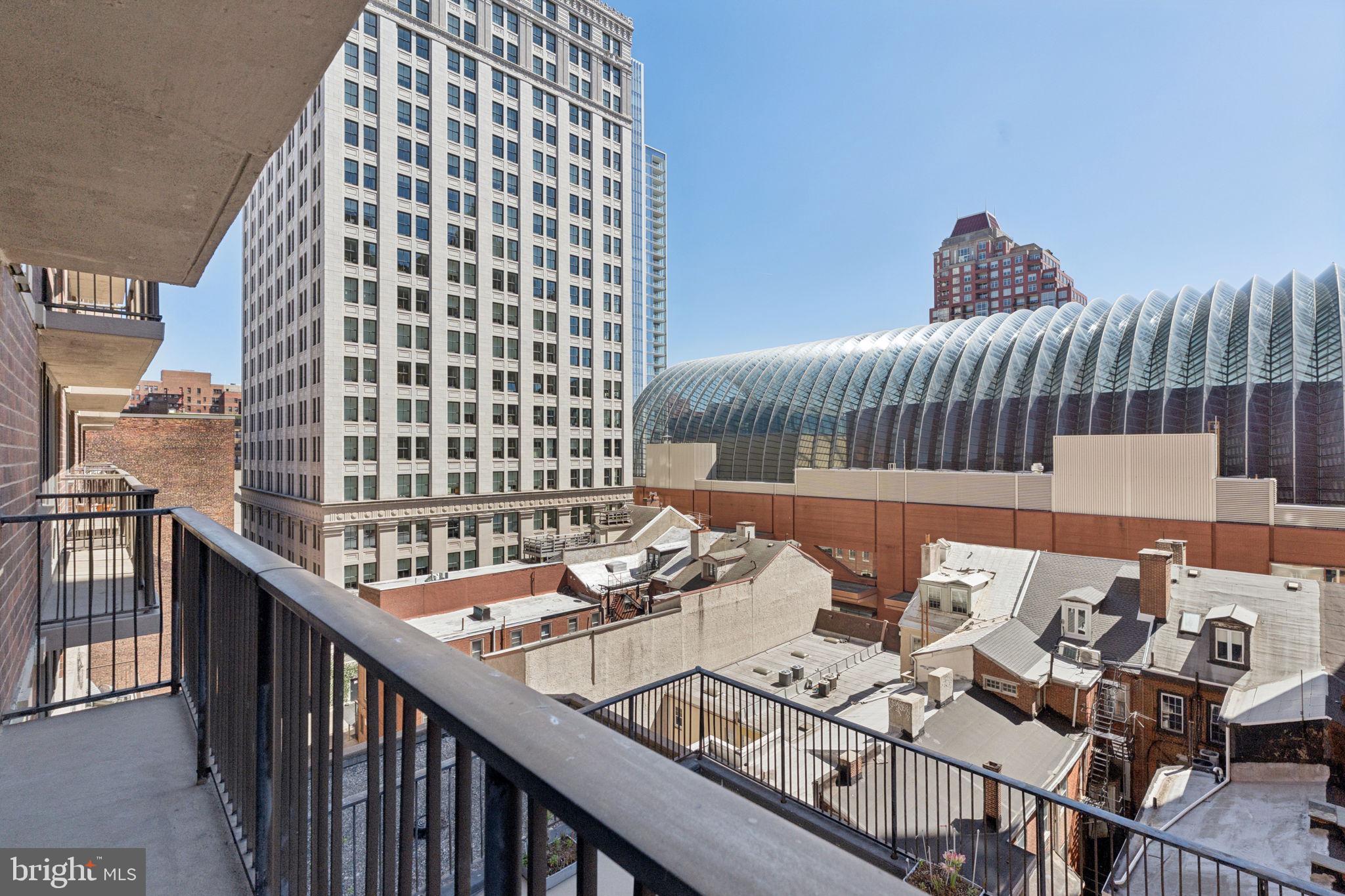 1420 Locust Street, Unit 7L Philadelphia, PA 19102 - Photo 13 of 25 a balcony with a table and chairs