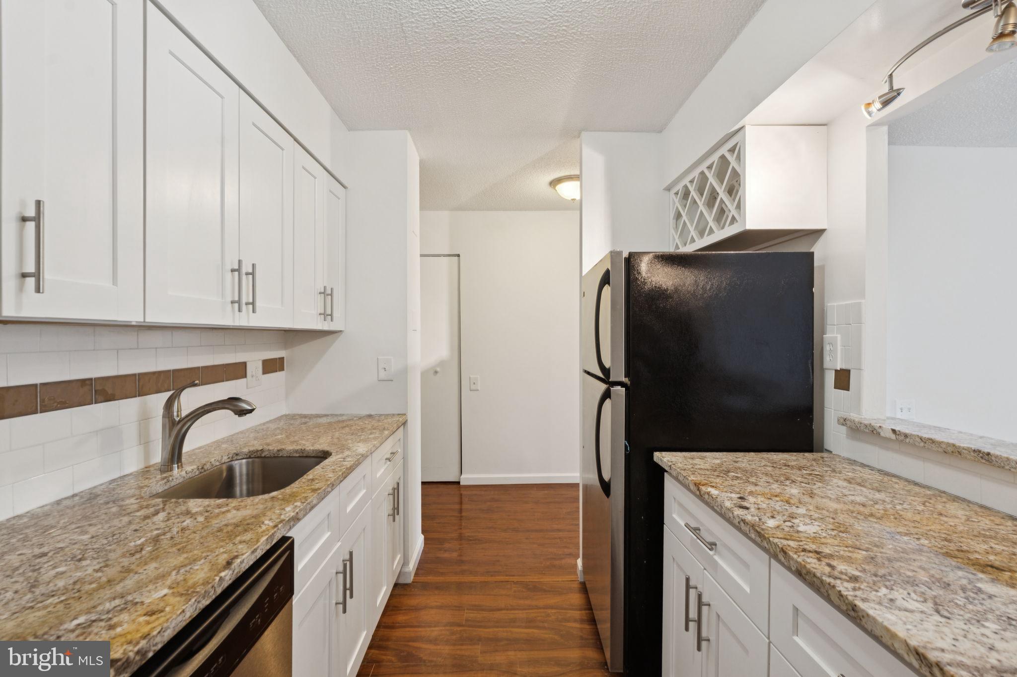 1420 Locust Street, Unit 7L Philadelphia, PA 19102 - Photo 6 of 25 a kitchen with a refrigerator and a sink