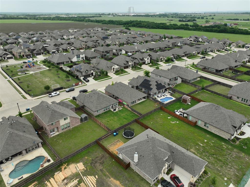 1084 Imperial Eagle Road Alvarado, TX 76009 - Photo 35 of 39 an aerial view of a city with lots of residential buildings and mountain view in back