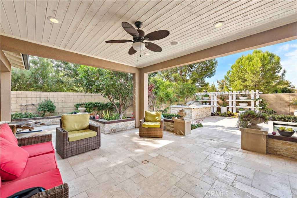 108 Fairgrove Irvine, CA 92618 - Photo 12 of 40 a living room with patio furniture and a floor to ceiling window