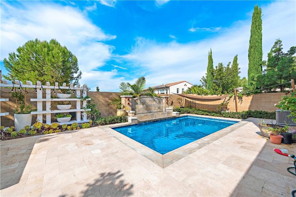 108 Fairgrove Irvine, CA 92618 - Photo 16 of 40 a view of a swimming pool with a lounge chairs