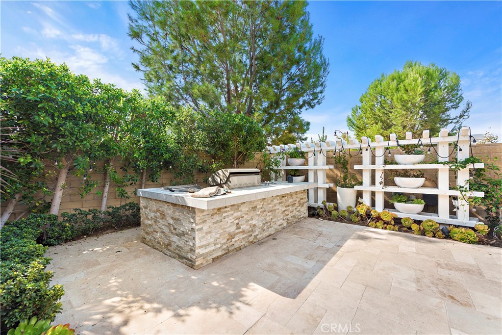 108 Fairgrove Irvine, CA 92618 - Photo 17 of 40 a view of a chairs and table in a backyard